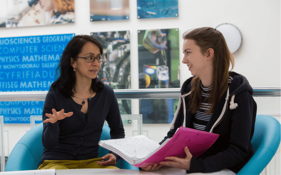 Advisor and a student in discussion. 