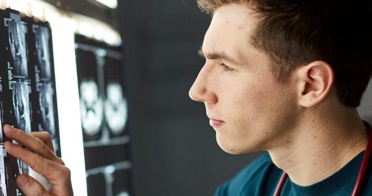 Medical student reviewing an xray
