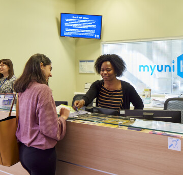 Student getting support from staff at myuni reception