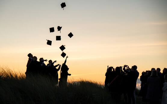 Students in their cap and gowns at Graduation