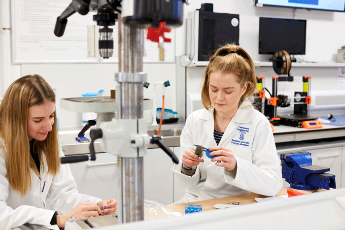 Female students in Mech lab