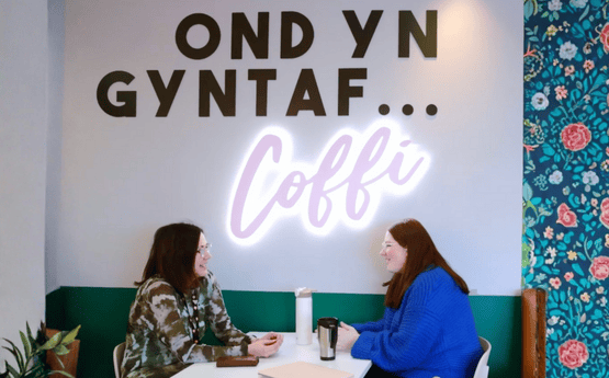 Students socialising in a cafe. 