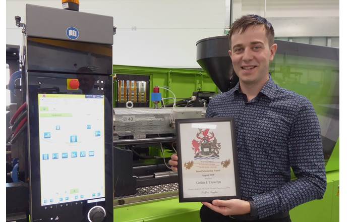 Gethin Llewelyn of Swansea University with his Livery Company award for his work to develop greener methods of making car parts