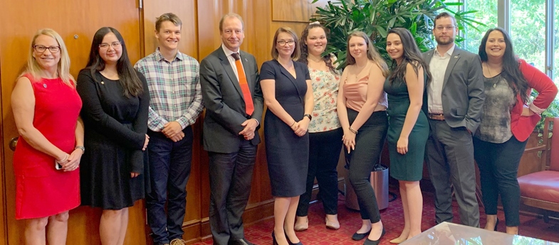 Professor Paul Boyle and Education Minister Kirsty Williams with current and former exchange students at the University of Houston.