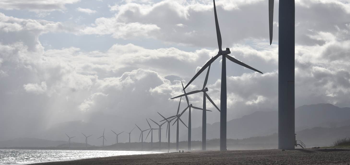 Wind turbines on a beach - Swansea research helps integrate renewables into the power grid