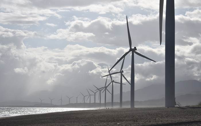 Wind turbines on a beach - Swansea research helps integrate renewables into the power grid
