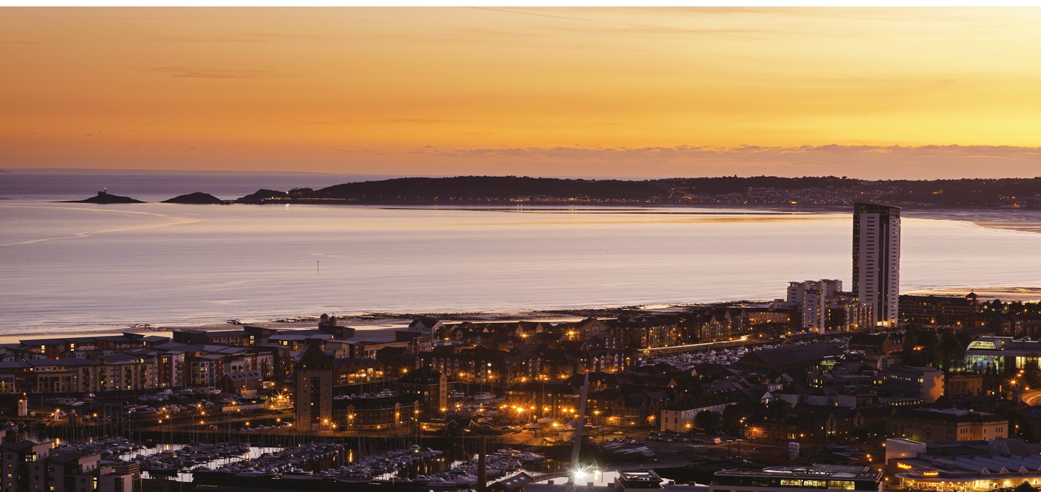 A view of Swansea city centre and Bay at sunset - researchers have shown the greatest impacts on marine life are still from waves and tides rather than human activity