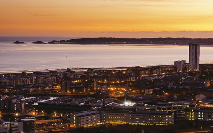 A view of Swansea city centre and Bay at sunset- researchers have shown the greatest impacts on marine life are still from waves and tides rather than human activity