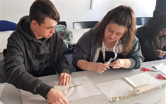 Dan and Lizzie working together wrapping presents as part of the Discovery project - pictured before the Covid-19 outbreak. Student volunteers are continuing to support and work with disabled adults by phone during the coronavirus outbreak