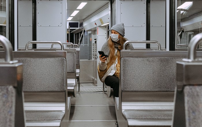 A woman sitting on her own in a train carriage during the coronavirus crisis. 