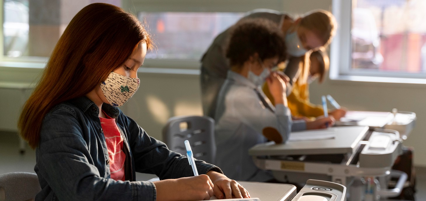 Pupils in a classroom wearing facemasks