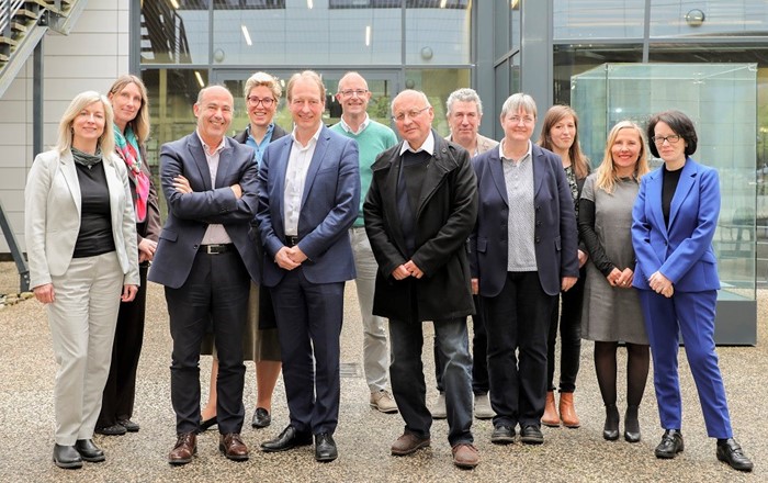 Vice Chancellor Prof Paul Boyle (fifth from left) and Prof Judith Lamie (right end of row) with senior figures from Université Grenoble Alpes 