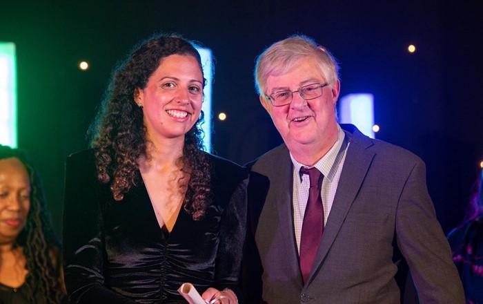 Dr Lella Nouri (L) with Mark Drakeford, Wales' First Minister, at the ceremony where she was presented with her award for her research and community work to counter hate