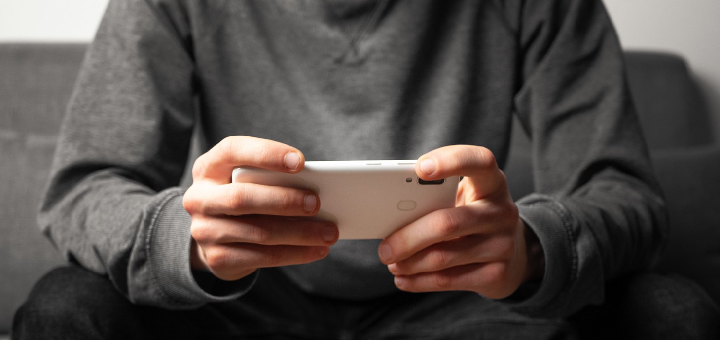 Close-up of a man's hands holding a mobile phone