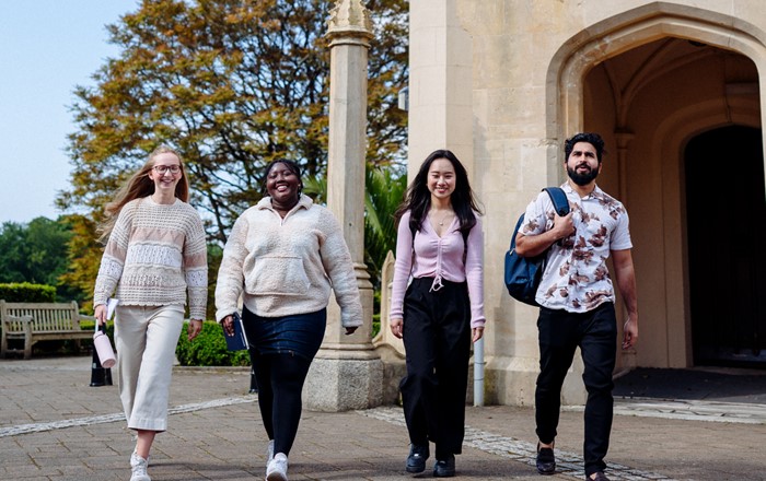 A small group of students standing outside Singleton Abbey