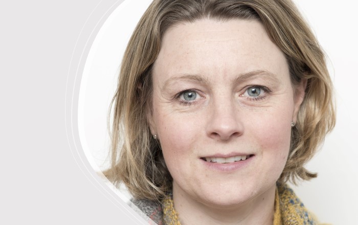Head and shoulders of a woman against a white background