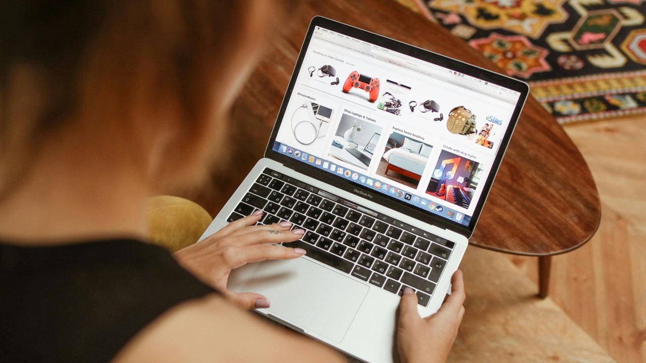 Woman looking at shopping page on a laptop