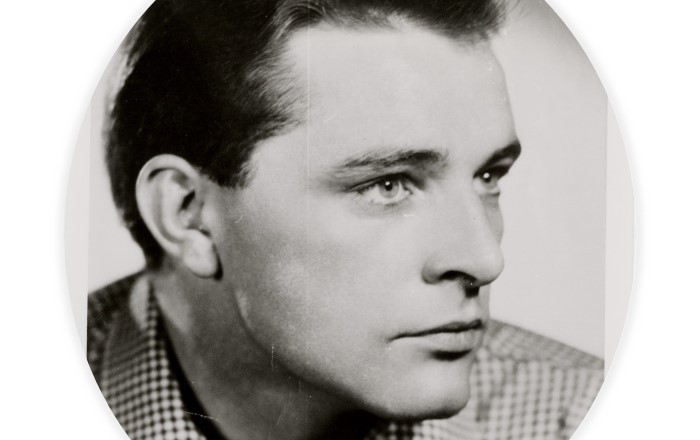 Black and white head and shoulders photo of a young man