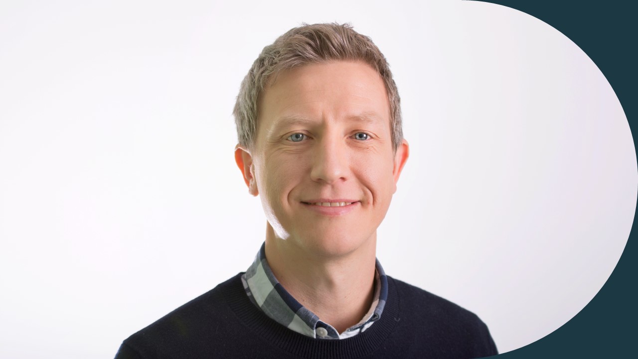 Head and shoulders photograph of a man 