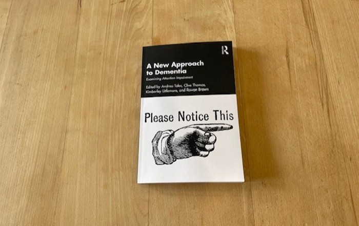 A copy of the book, A New Approach to Dementia: Examining Attention Impairment.