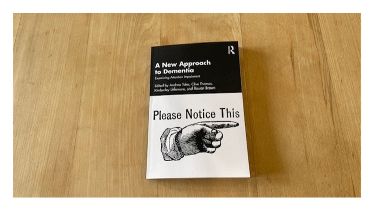 A copy of the book, A New Approach to Dementia: Examining Attention Impairment.