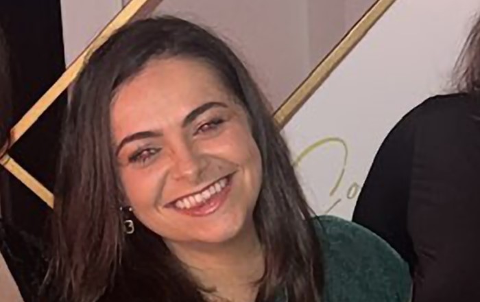 Head and shoulders photo of a smiling young woman