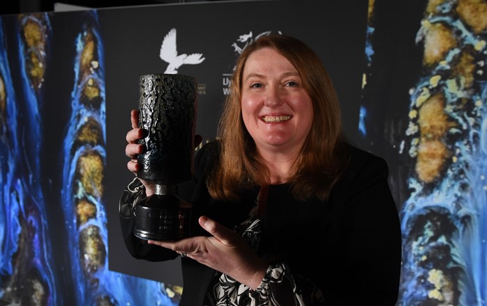 Woman holding trophy
