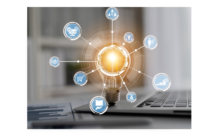 Image of computer keyboard with bright light bulb 