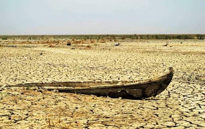 Remains of a boat on a dried-up river bed.