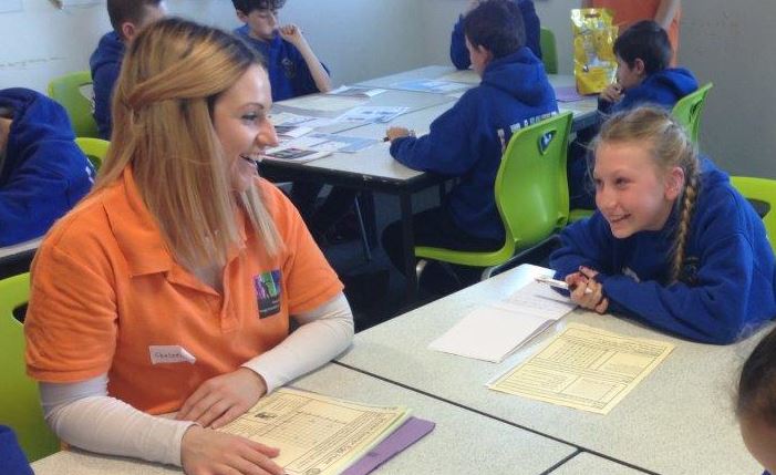 Student leader works with a primary pupil