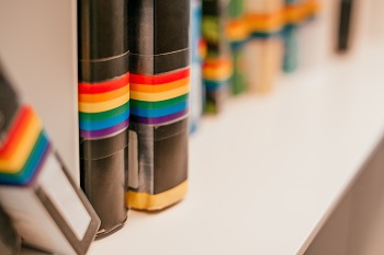 Books with rainbow flag on binding