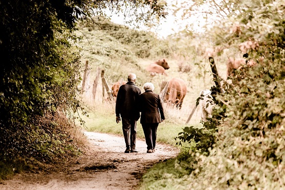 elderly couple walking