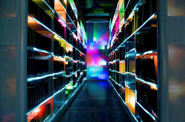 Books on shelves with multi-coloured lights