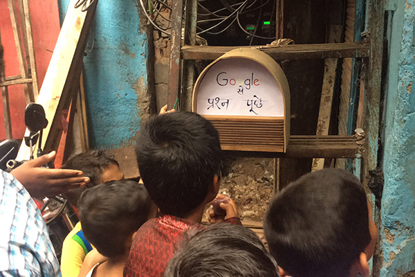 Children in Mumbai with made Google postbox smart speaker