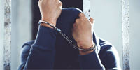 person in handcuffs 