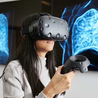 Female student using VR headset