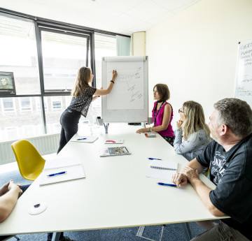 people sitting around an office table