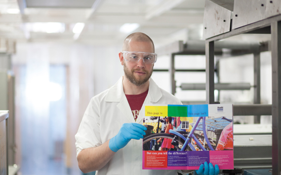 Researcher holding a leaflet