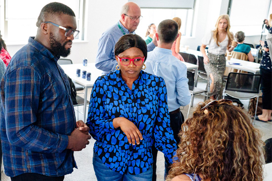 A man and a woman talking to a lady