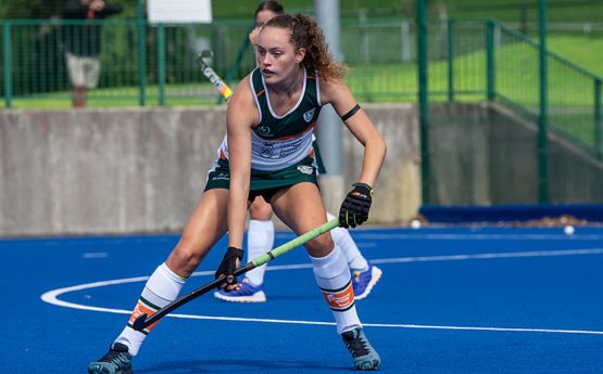 Women's hockey team on new pitch during match at Swansea Bay Sports Park