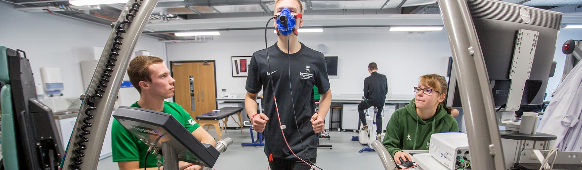 Student on treadmill with mask