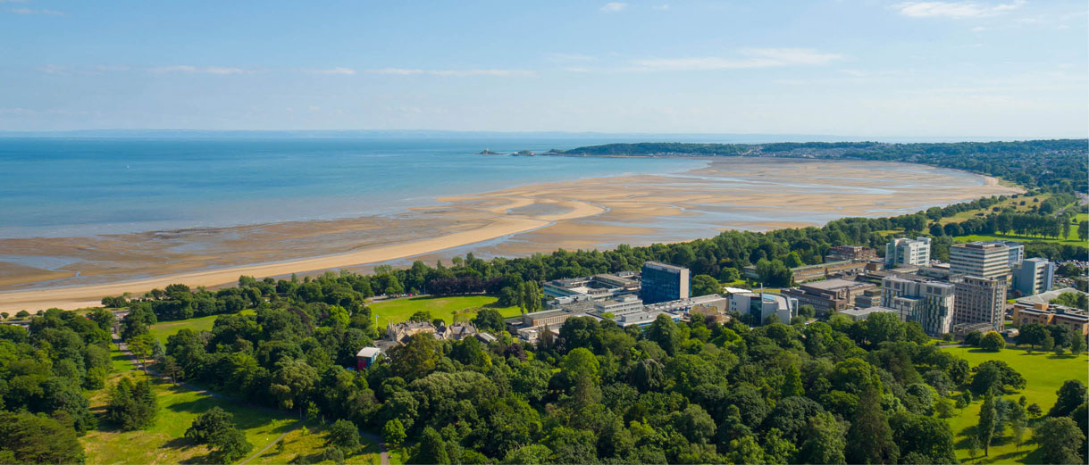 A view of Singleton Campus including Singleton Park and the beach, with the sea stretching into the horizon