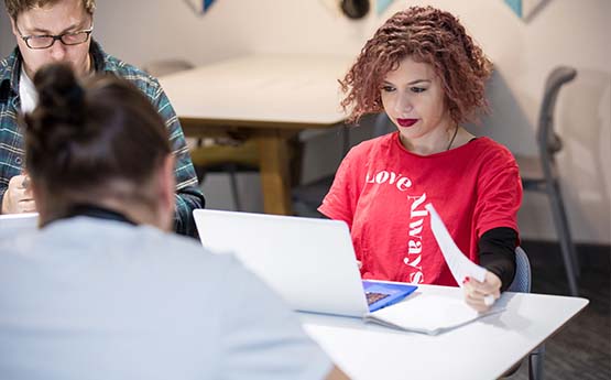 A female student using a laptop