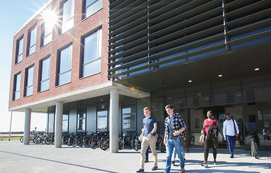School of Management building, Bay Campus with students walking through the doors