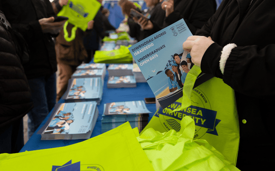 Prospectuses being handed out.