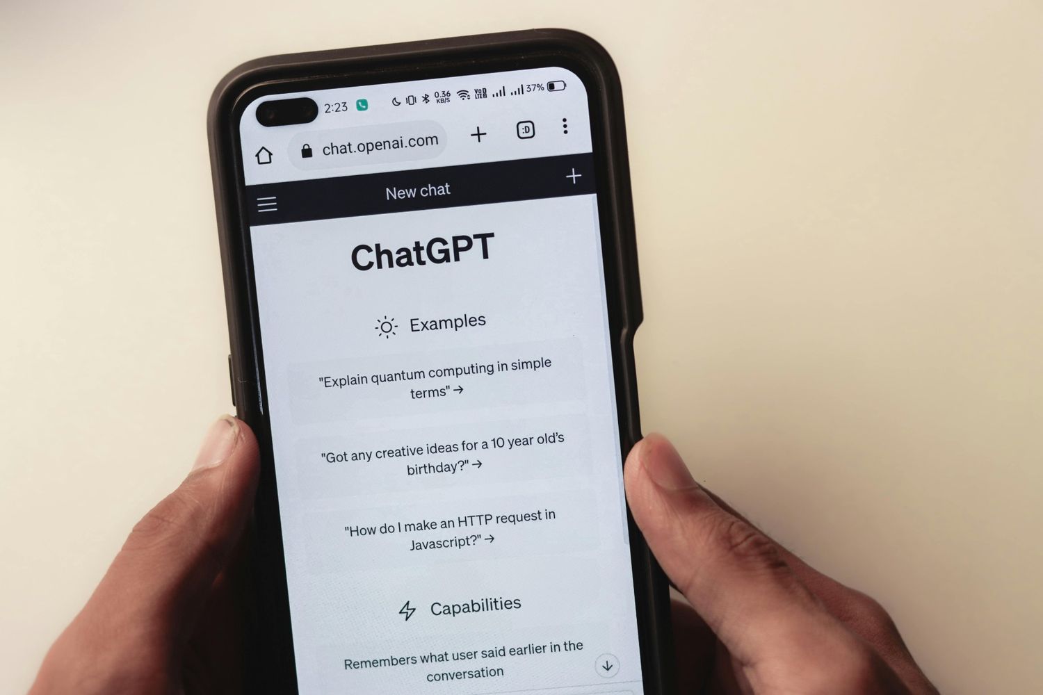 A phone screen showing the ChatGPT website