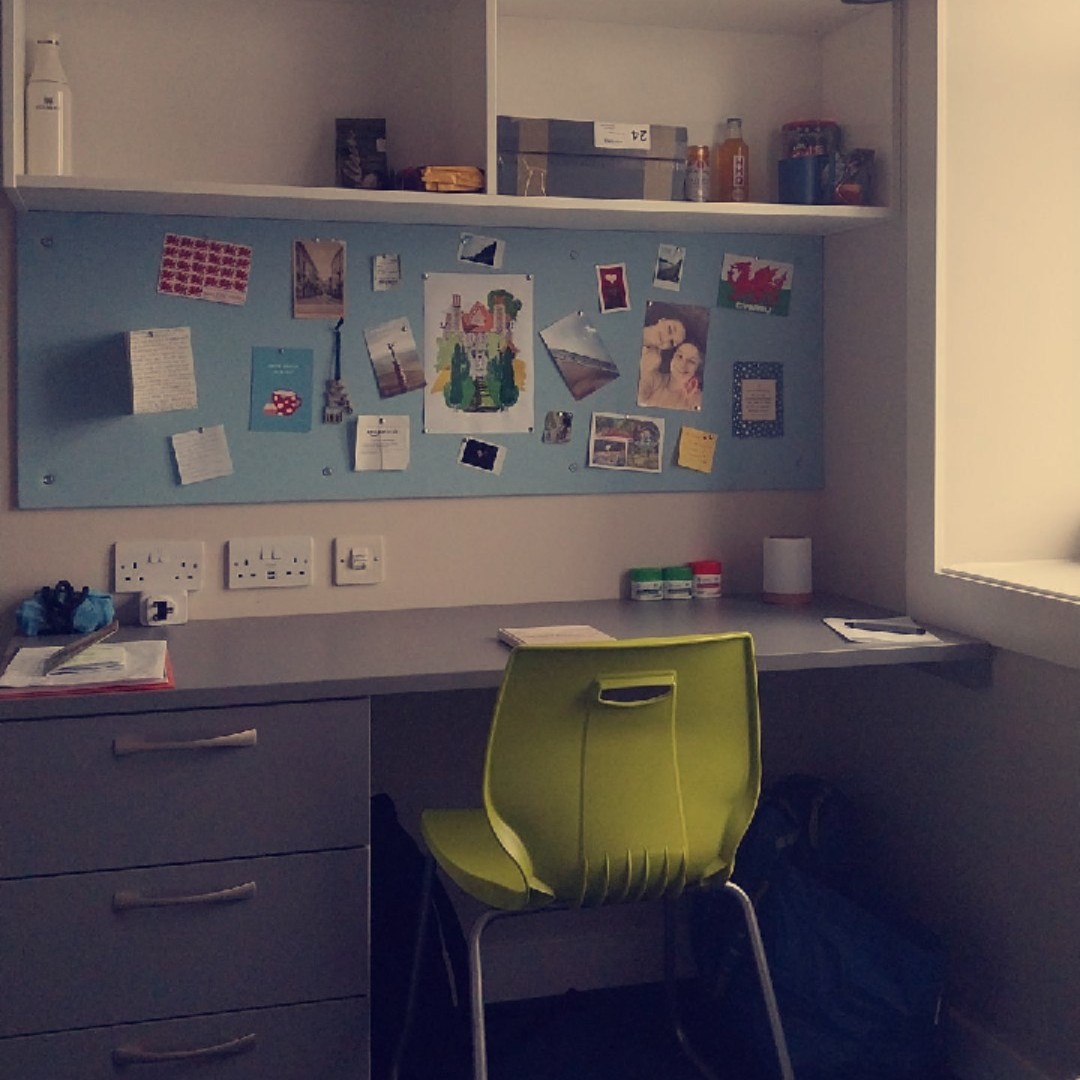 Photo of a student's desk inside their dorm.