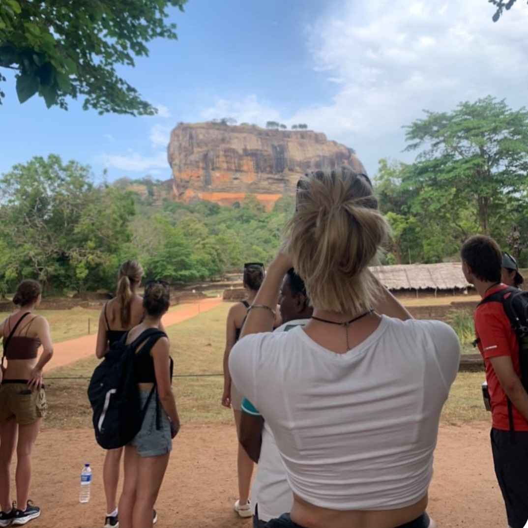 Student taking photo of landscape