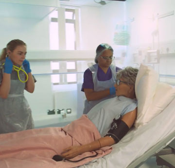 Nursing and Graduate Entry student working within simulation suite