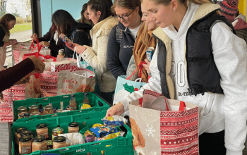 Students selecting food items at the community fridge event